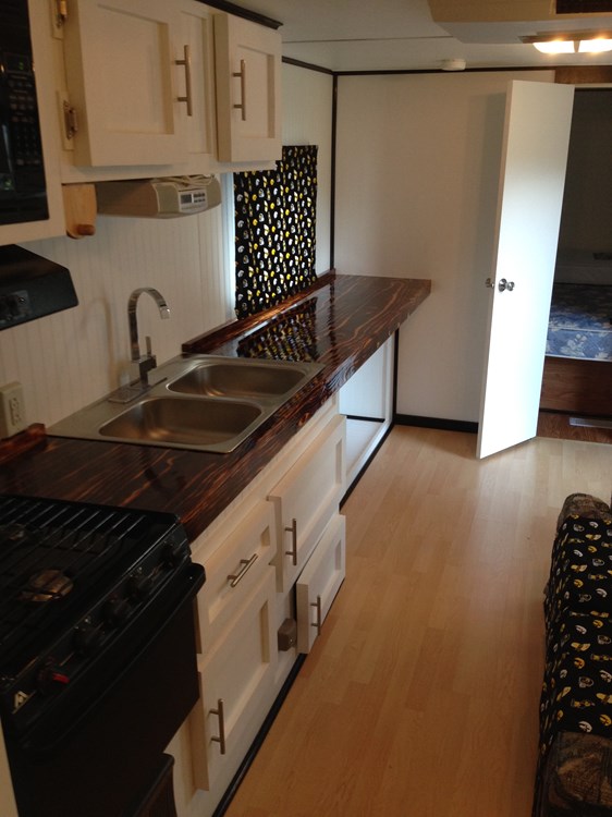 Remodeled 2006 Camper Inspired by the tiny house movement, includes Custom Fire-Torched Countertops - Image 2 Thumbnail