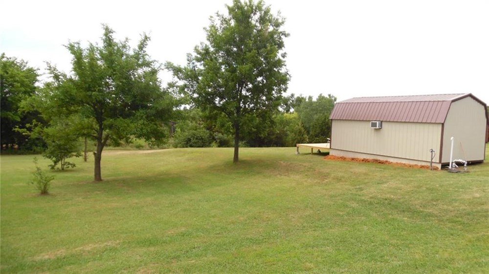 Beautiful Tree Dotted 5 acres,  POND, Storm Cellar, Storage Semi & Tiny BILLS! - Image 4 Thumbnail