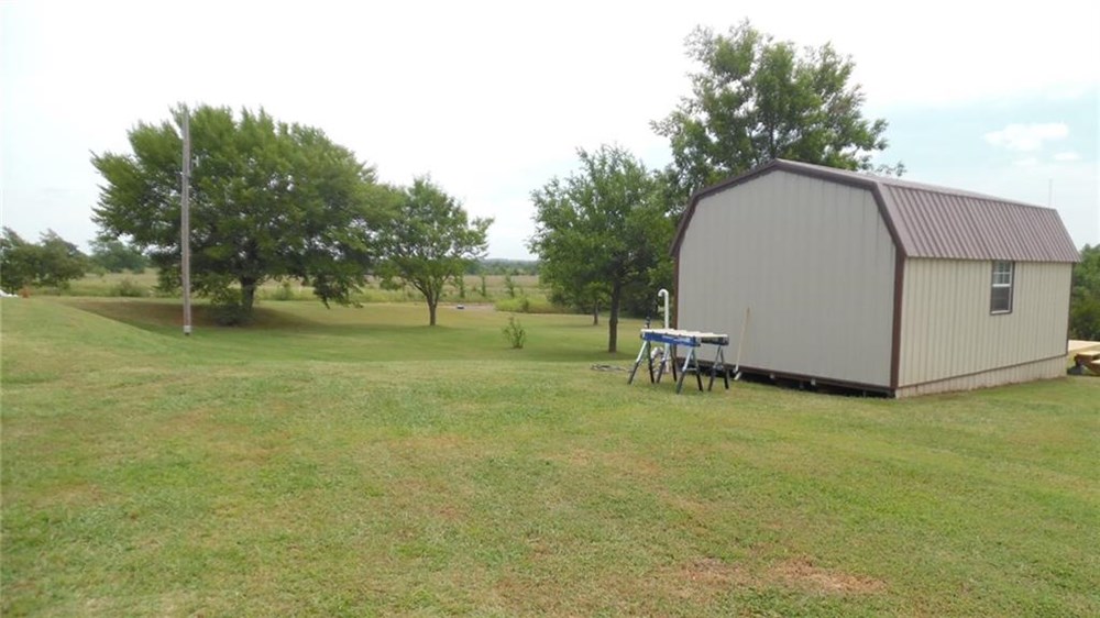 Beautiful Tree Dotted 5 acres,  POND, Storm Cellar, Storage Semi & Tiny BILLS! - Image 3 Thumbnail