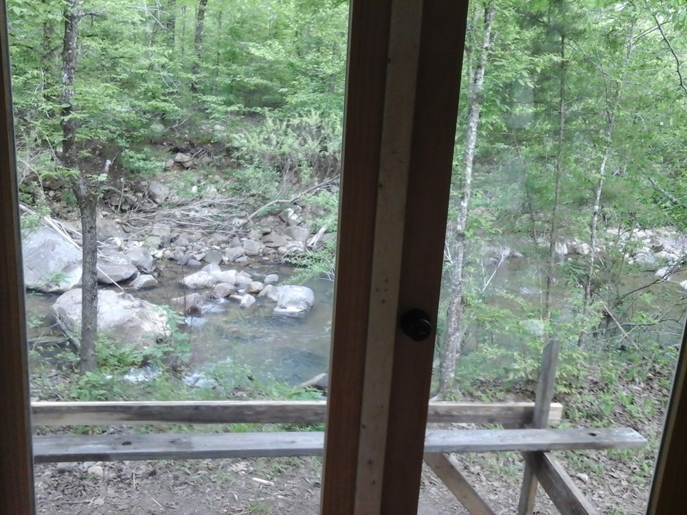 Tiny house shell on creek on 28 acres near Hot Springs, Arkansas - Image 2 Thumbnail