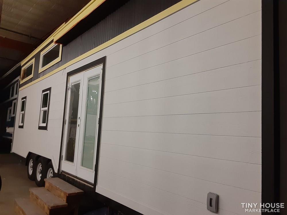 30' Tiny House with two Queen Lofts, large living or third bedroom.