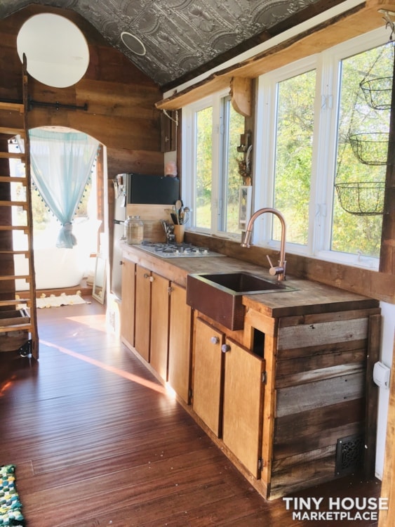 Contemporary Rustic Tiny House on Wheels built out of Recycled Materials.