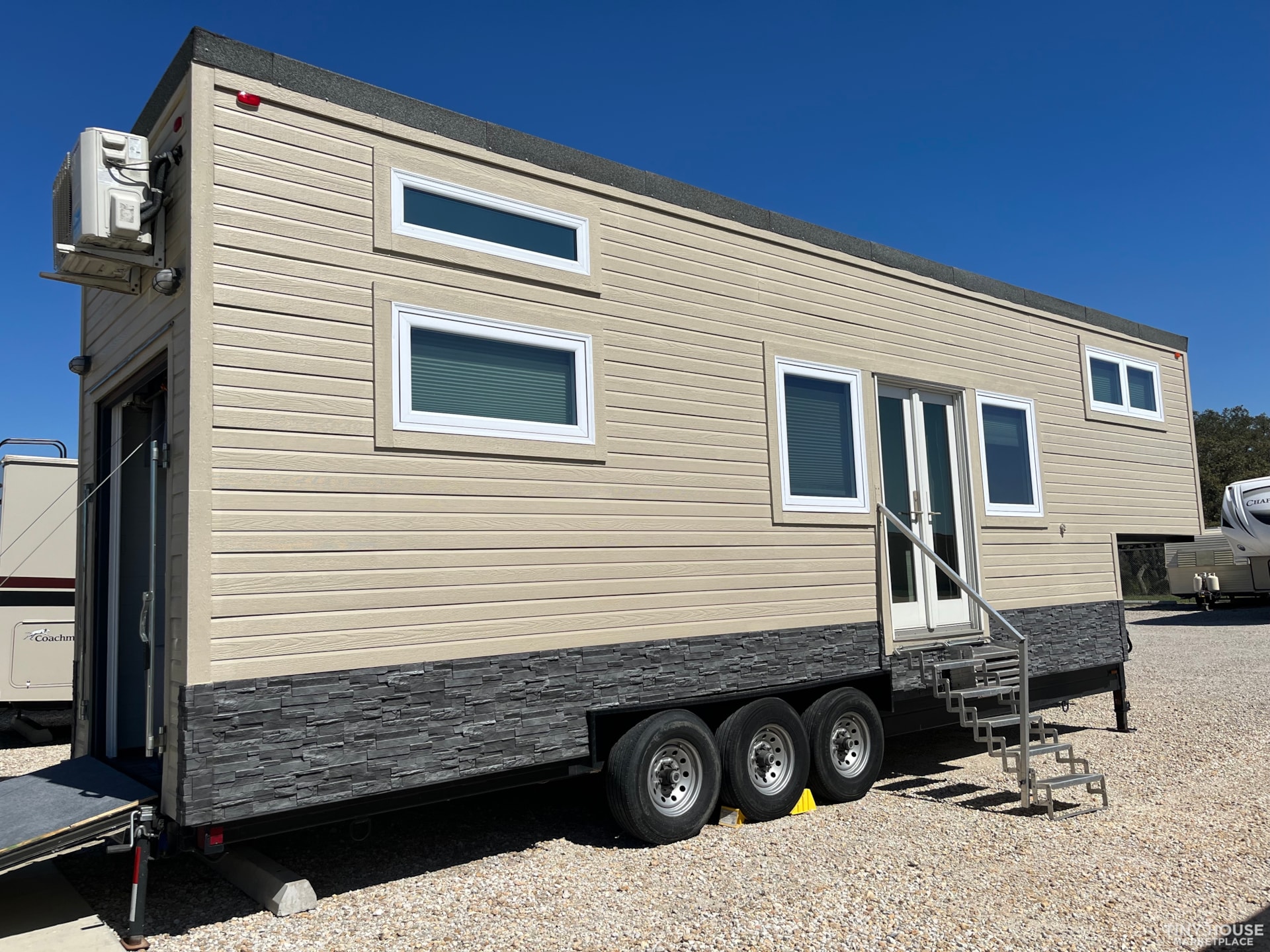 Off Grid Ready - Custom 35' Tiny Home on Wheels (Toy Hauler) - Image 1 Thumbnail