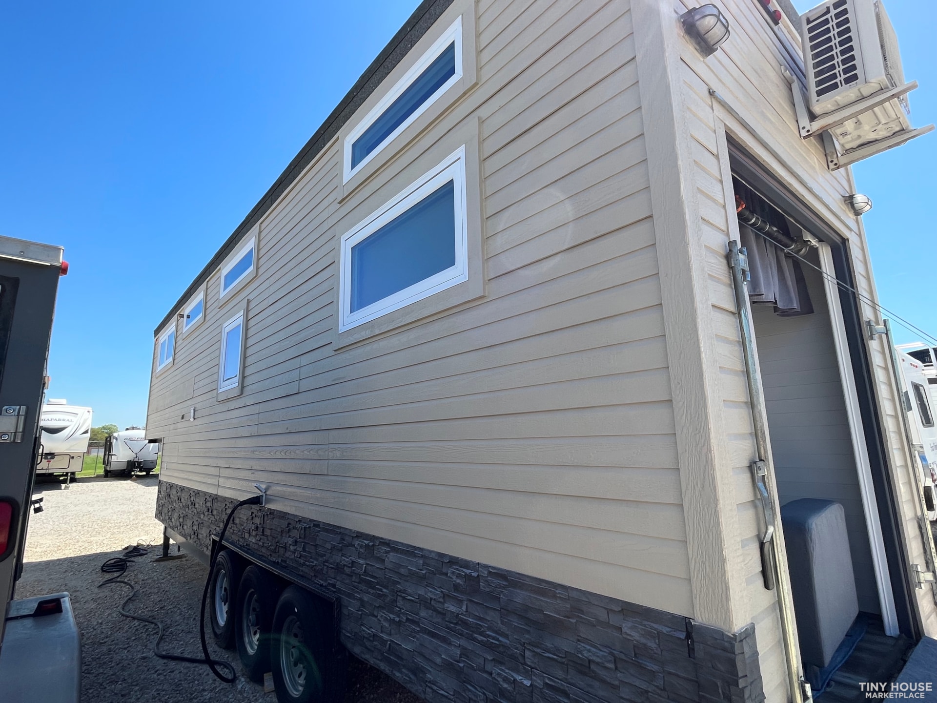 Off Grid Ready - Custom 35' Tiny Home on Wheels (Toy Hauler) - Image 2 Thumbnail