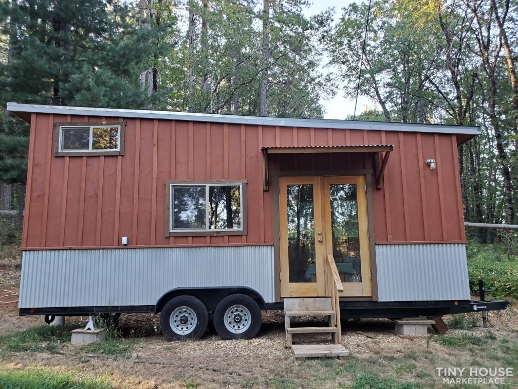 Custom wood paneled tiny house on trailer