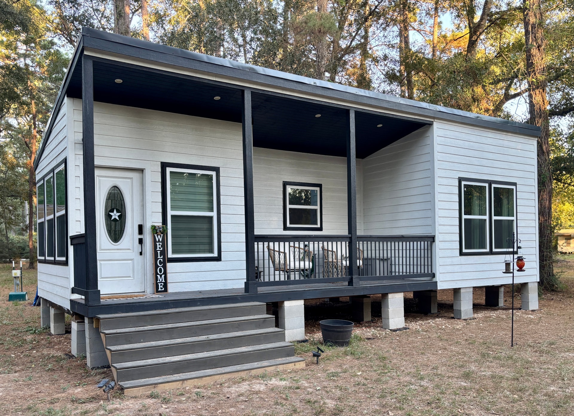 Cute and cozy 15x35 tiny home with a great porch!