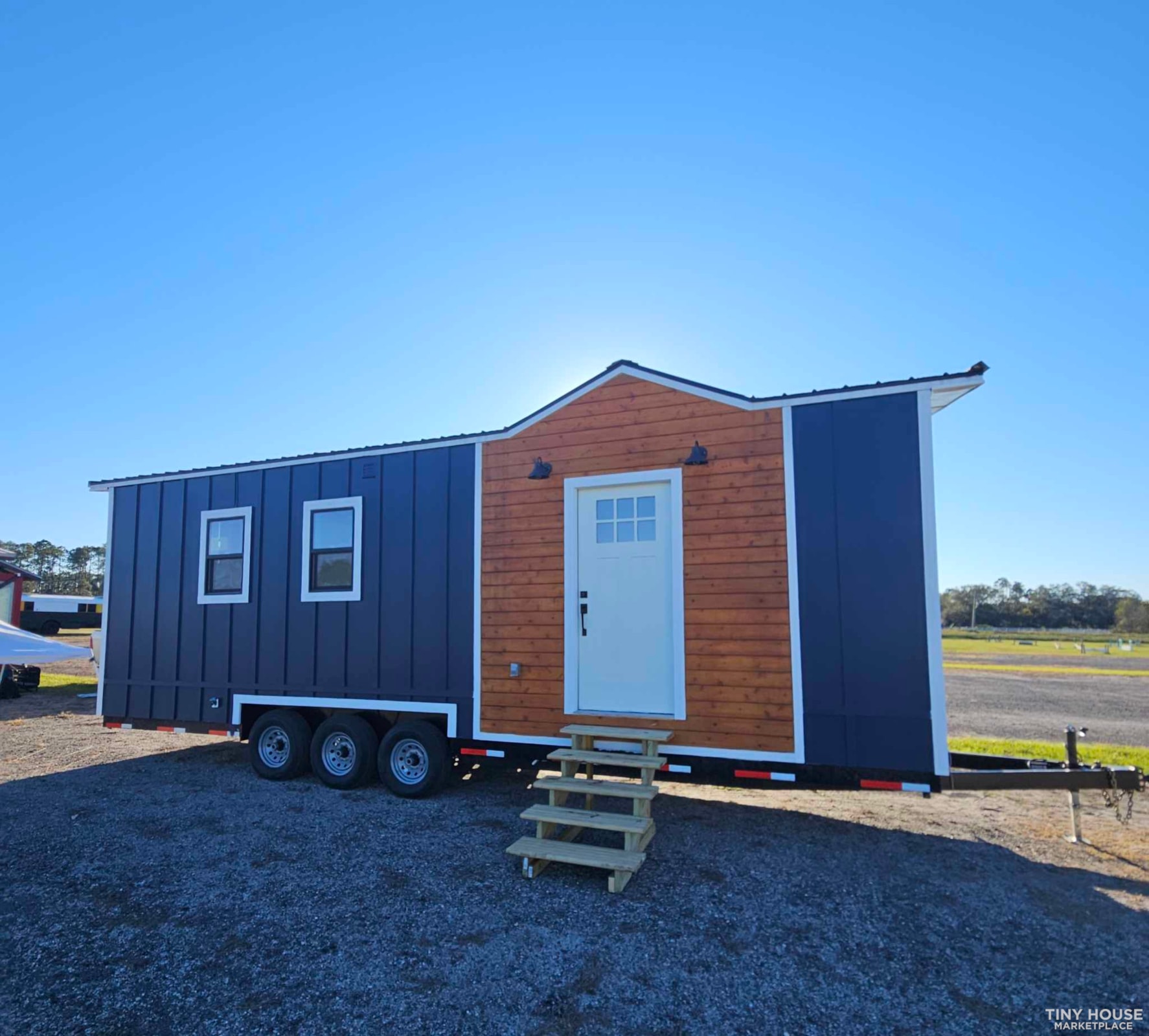 Downstairs Bedroom, full size kitchen and bathroom tiny home on wheels