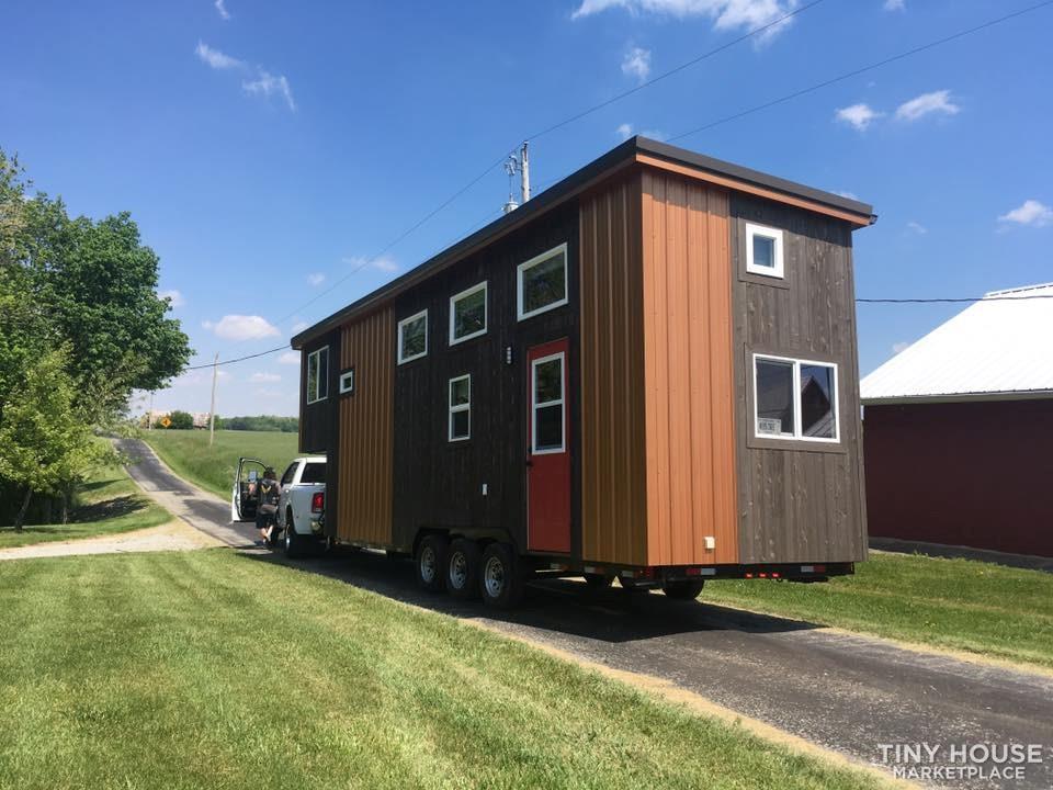 Beautiful custom 8x33 home with stairs to Master BR and tons of storage