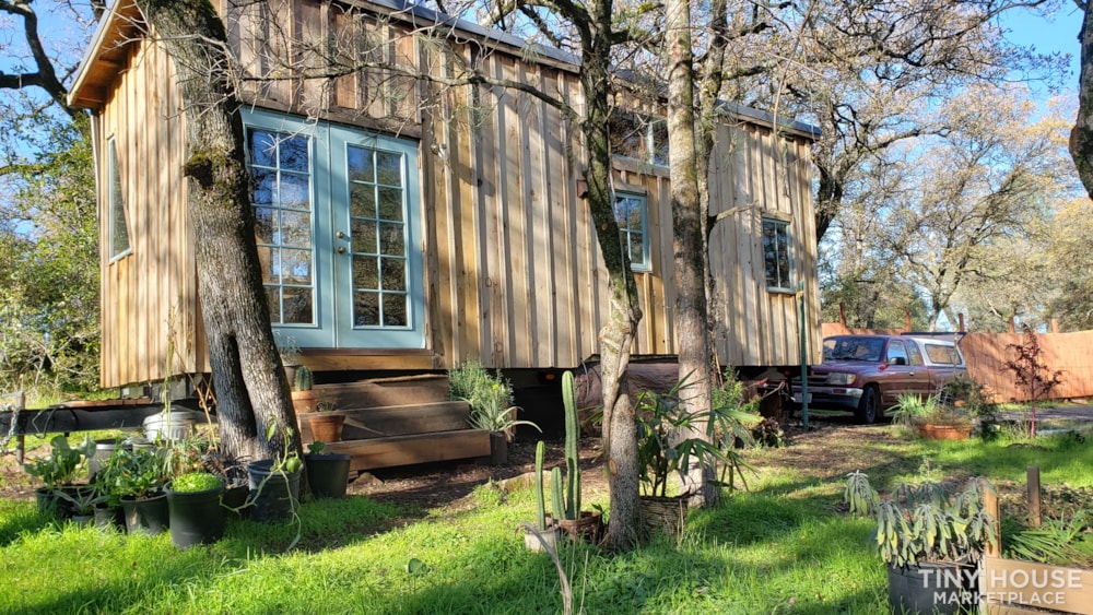 Rustic self-sufficient 31' handmade redwood tiny house